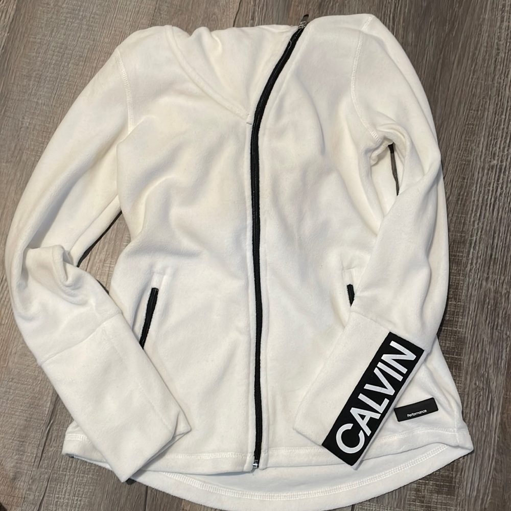 size small. calvin klein zip up